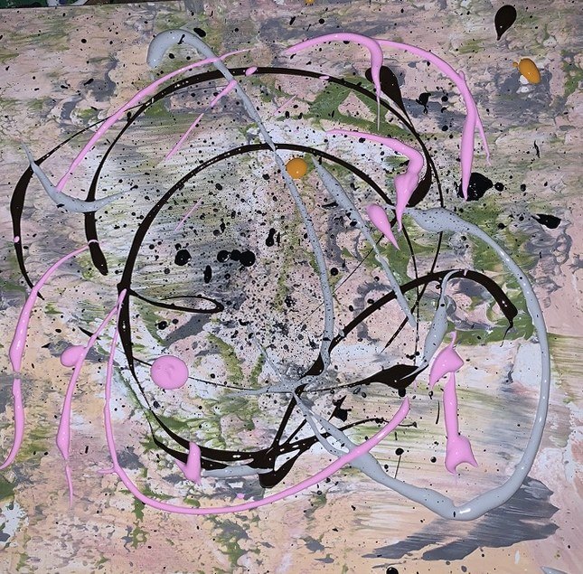 Speckled ground with black and pink concentric loops